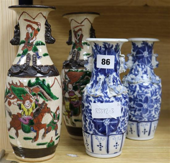A pair of Chinese warriors crackle glaze vases and a pair of blue and white vases tallest 25cm